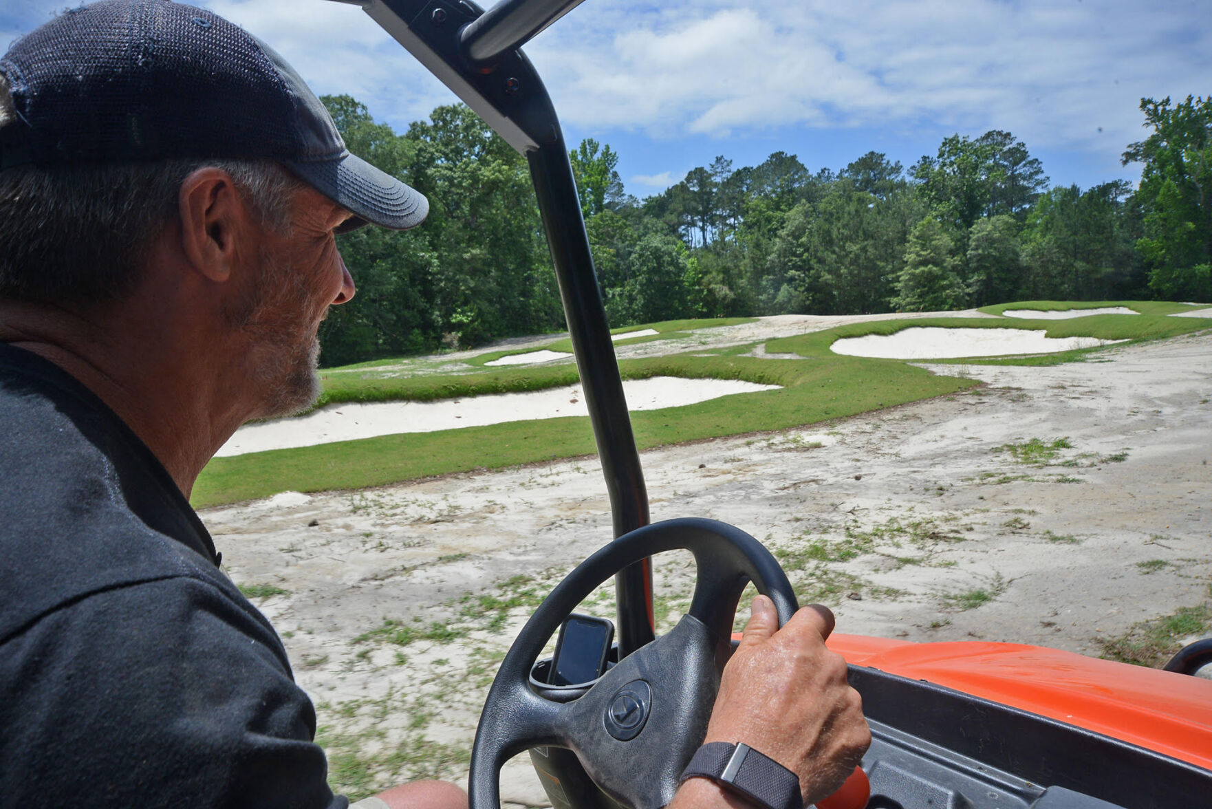 Chris Dwiggins, golf superintendent at Woodlake, on the 8th hole of the community’s Ellis Maples-designed course.